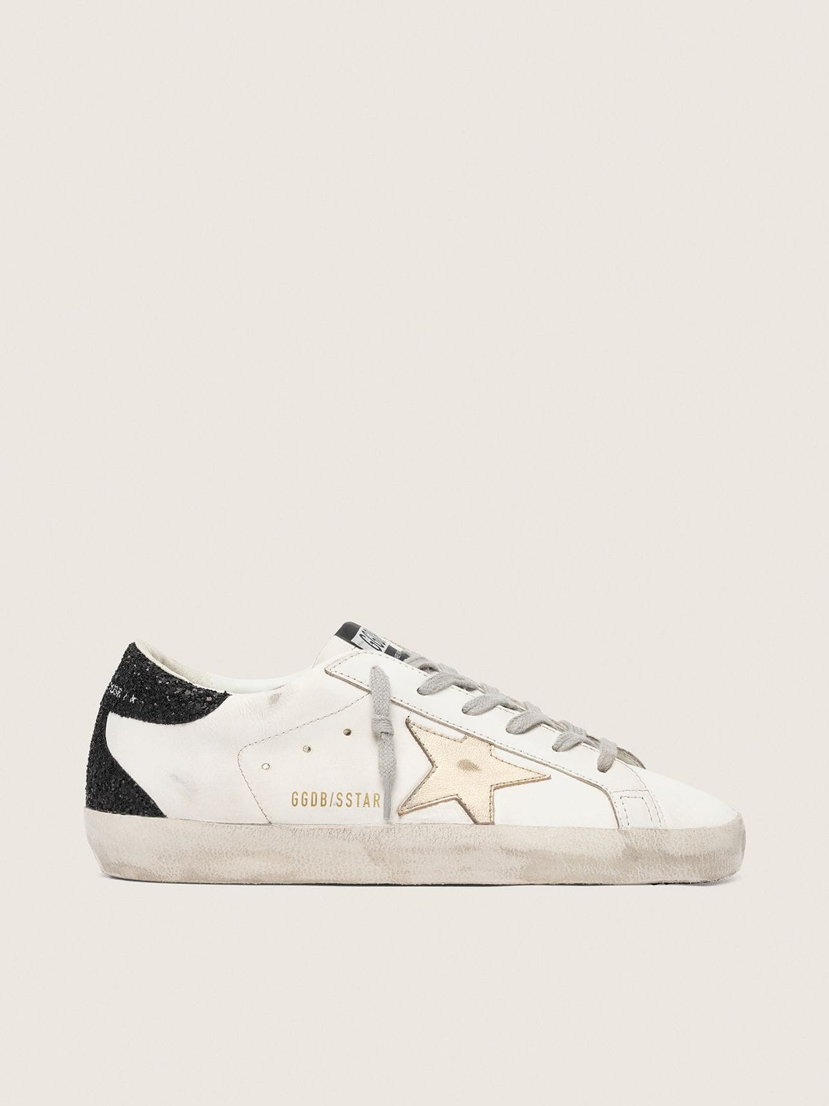 Super-Star pour femme avec étoile dorée et contrefort à paillettes noires