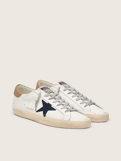 Super-Star en cuir blanc avec étoile en toile bleu nuit et contrefort en cuir couleur tabac