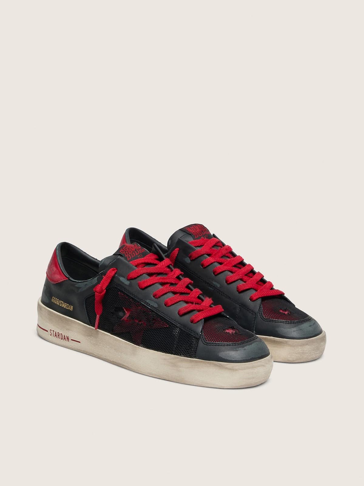 Stardan homme en cuir noir avec étoile en cuir rouge et empiècements en résille noire et cuir rouge