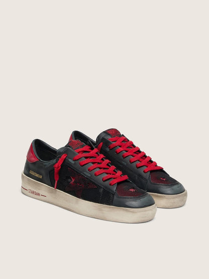 Stardan homme en cuir noir avec étoile en cuir rouge et empiècements en résille noire et cuir rouge