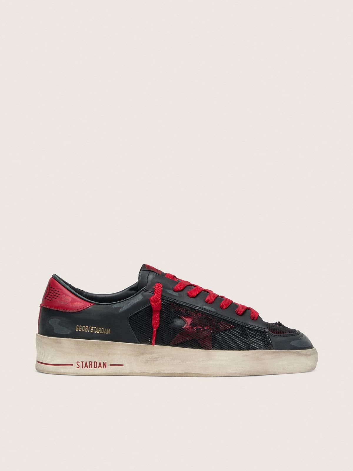 Stardan homme en cuir noir avec étoile en cuir rouge et empiècements en résille noire et cuir rouge