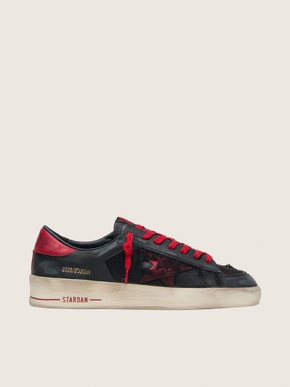 Stardan homme en cuir noir avec étoile en cuir rouge et empiècements en résille noire et cuir rouge