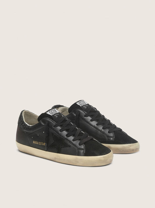Super-Star pour femme en cuir nappa noir avec étoile noire et contrefort à paillettes