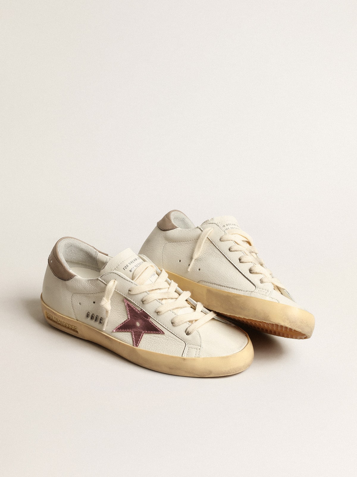 Super-Star pour femme en cuir nappa blanc avec étoile en cuir métallisé rose