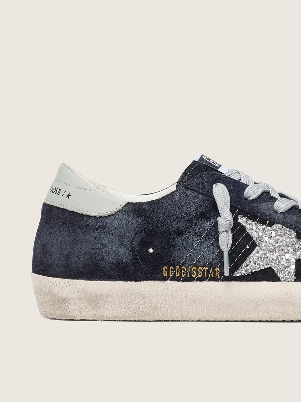 Super-Star pour femme en daim bleu avec étoile à paillettes argentées et contrefort en cuir
