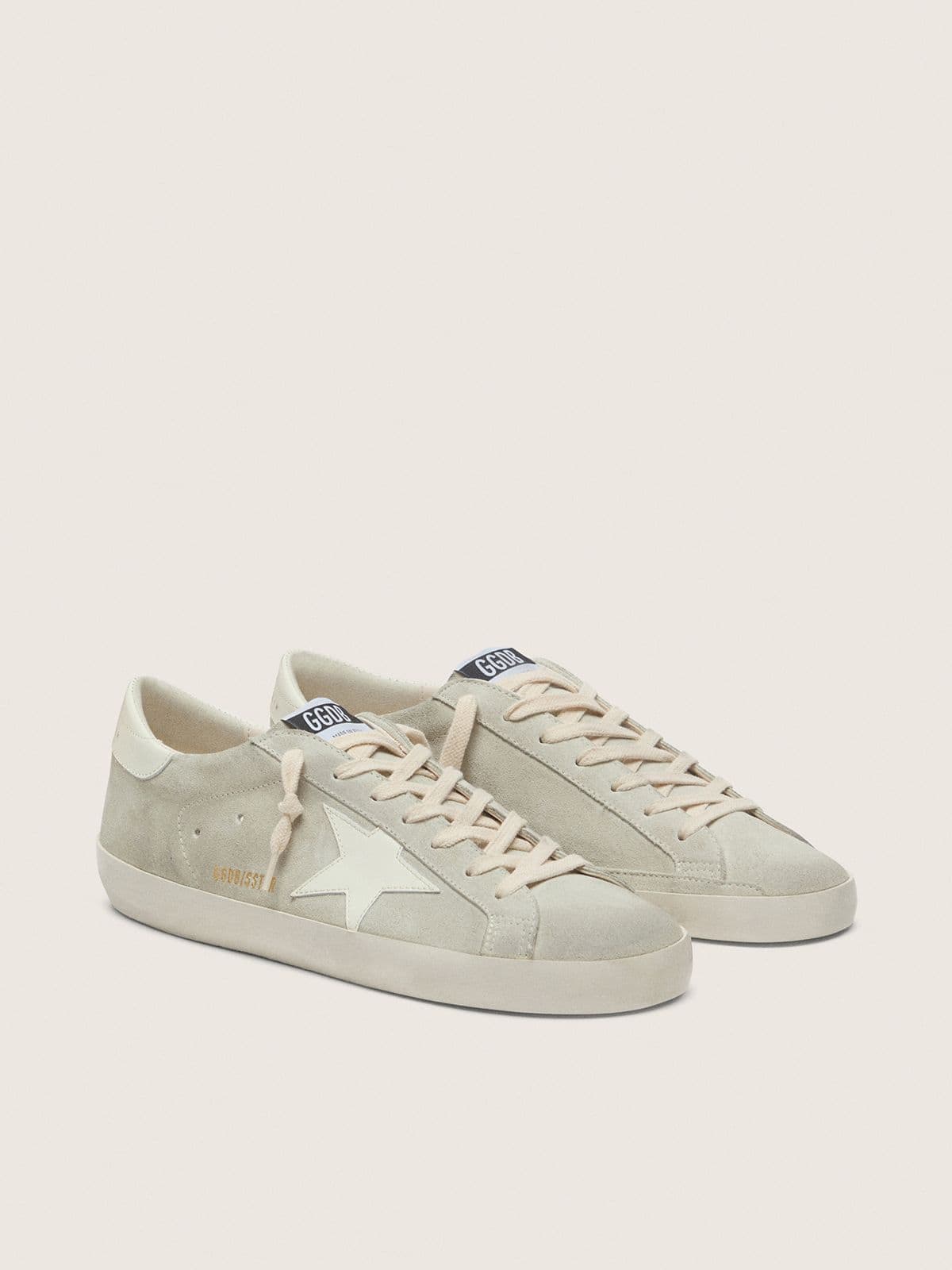 Super-Star pour femme en daim gris clair avec étoile en cuir blanc