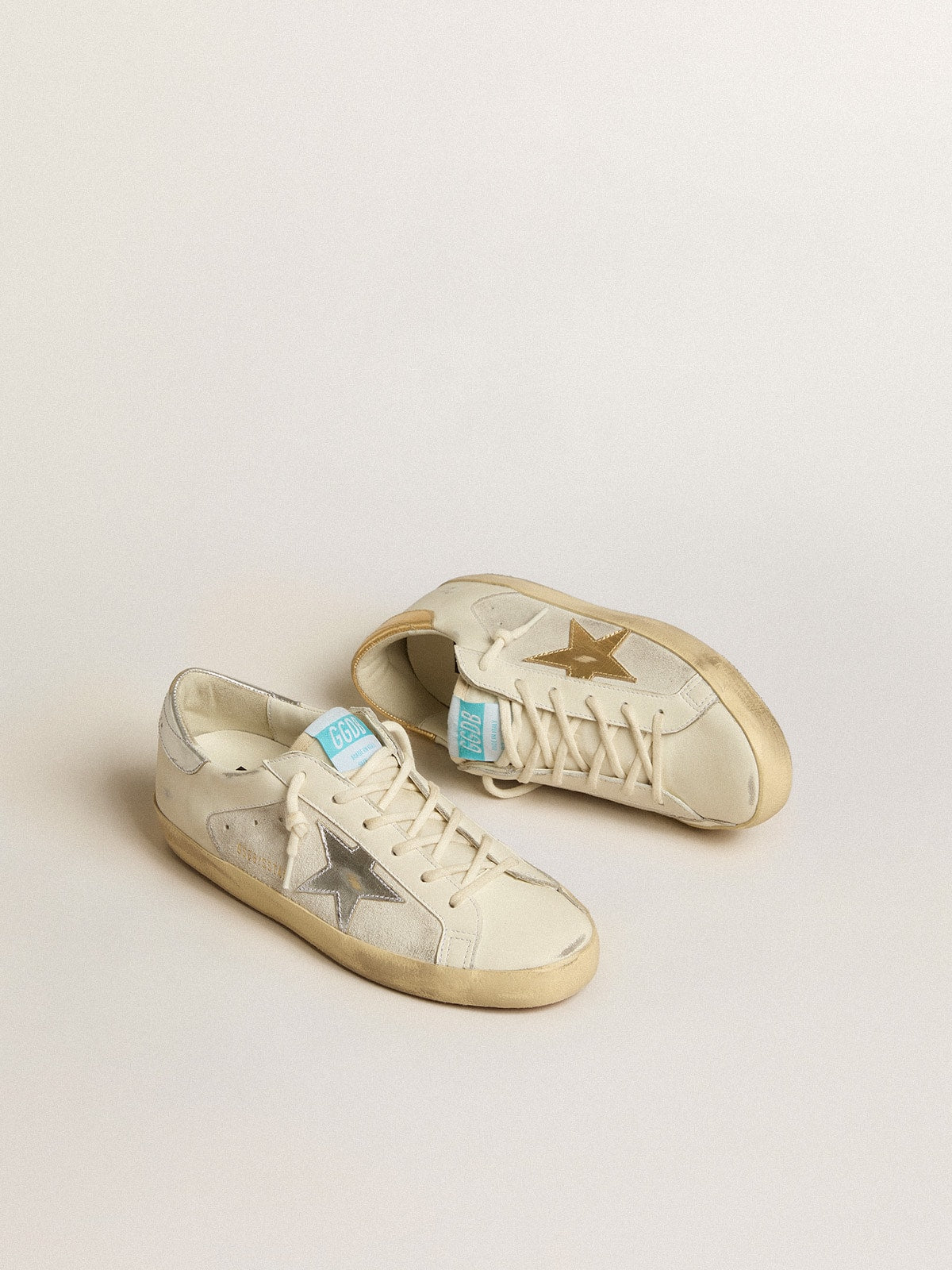 Super-Star en cuir blanc et daim avec étoile en cuir argenté et doré